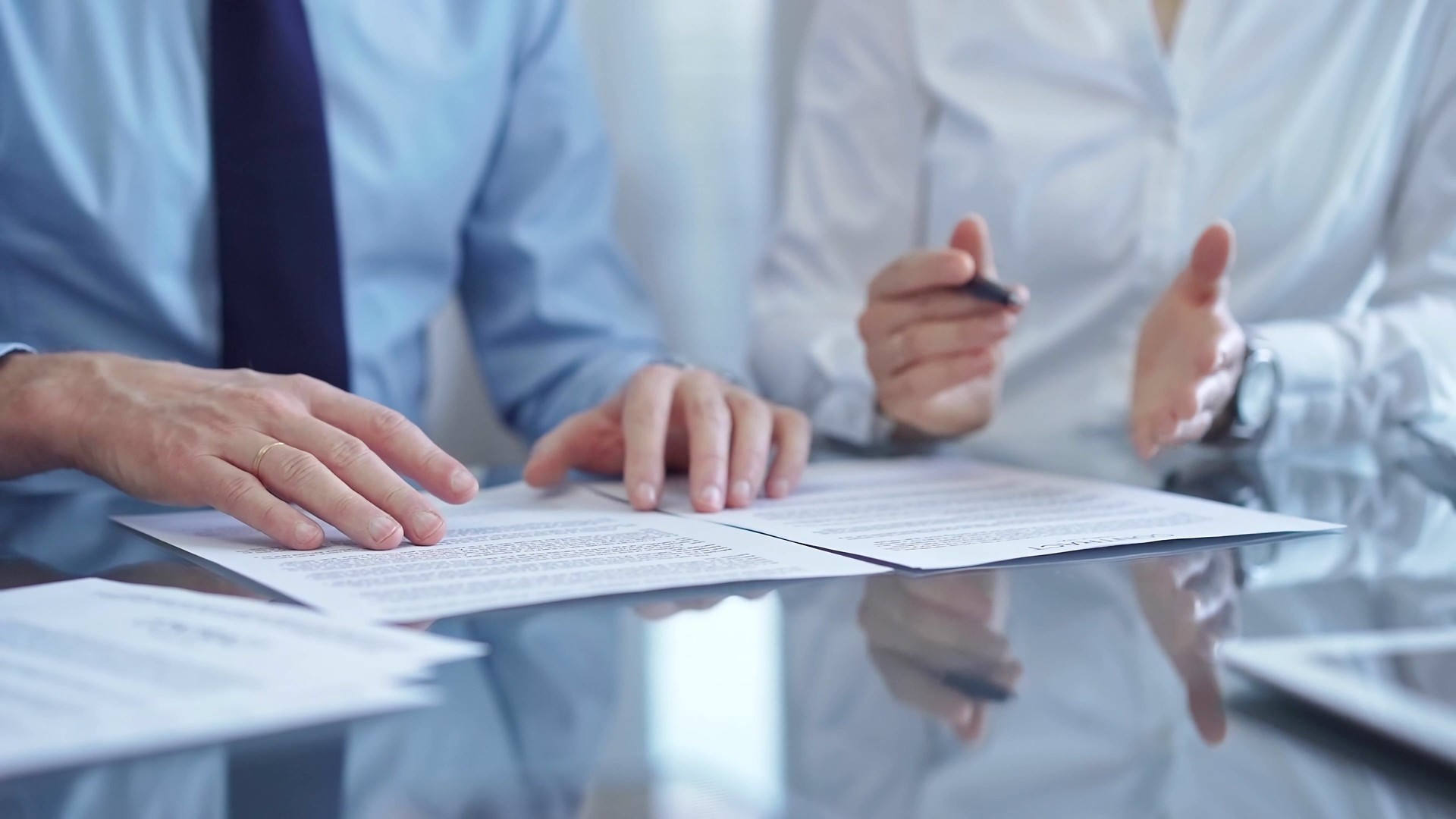 Diverse business people discussing contract papers before signing. Teamwork of lawyers are at work in office